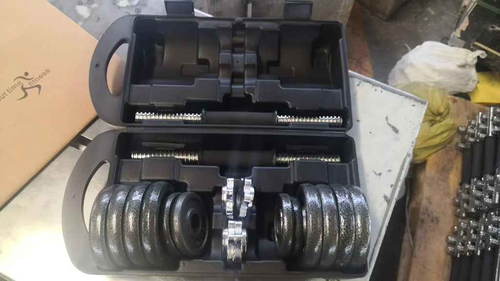 Home gym weightlifting dumbbells of 10kg 15kg 20kg 30kg with set of cast iron dumbbells painted black.